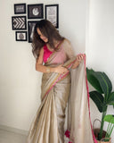Classy Gold and Pink Saree with Glossy Finish and Tassel Accents