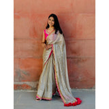 Classy Gold and Pink Saree with Glossy Finish and Tassel Accents