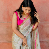 Classy Gold and Pink Saree with Glossy Finish and Tassel Accents