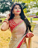 Classy Gold and Pink Saree with Glossy Finish and Tassel Accents