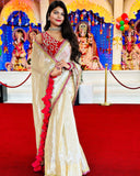 Classy Gold and Pink Saree with Glossy Finish and Tassel Accents