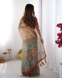 Beige & Green Handloom Cotton Saree with Village Life Print and Majestic Peacock Pallu